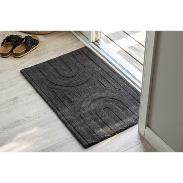 Olav - Drmtte i mrkegr uld, rektangulr 50 x 80 cm.