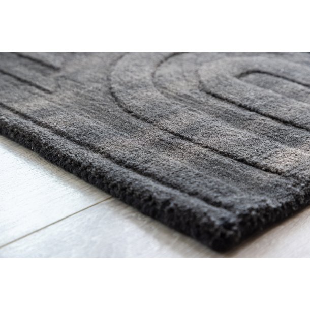 Olav - Drmtte i mrkegr uld, rektangulr 50 x 80 cm.