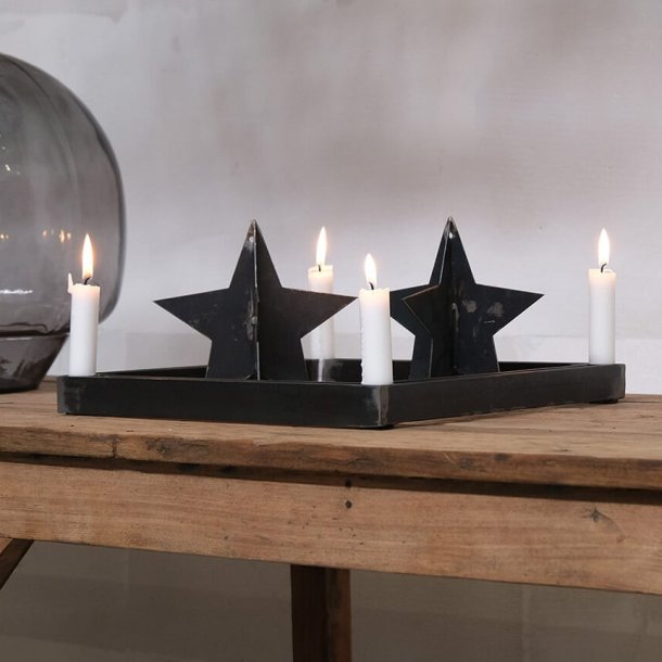 Stj�rna i patinerad svart metall