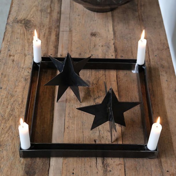 Stj�rna i patinerad svart metall